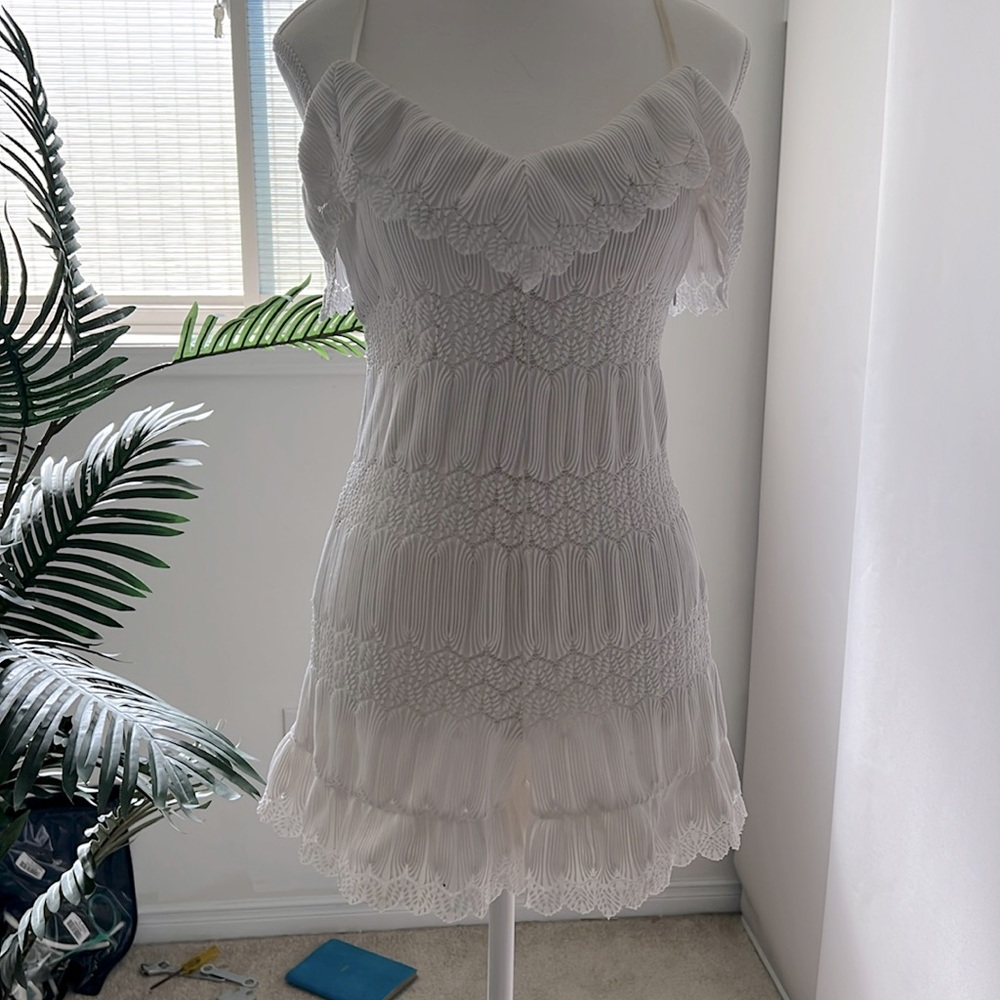 Guess Bands of textured lace breezy romper.